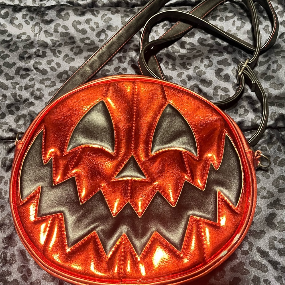 Love pain stiches metallic red pumpkin bag